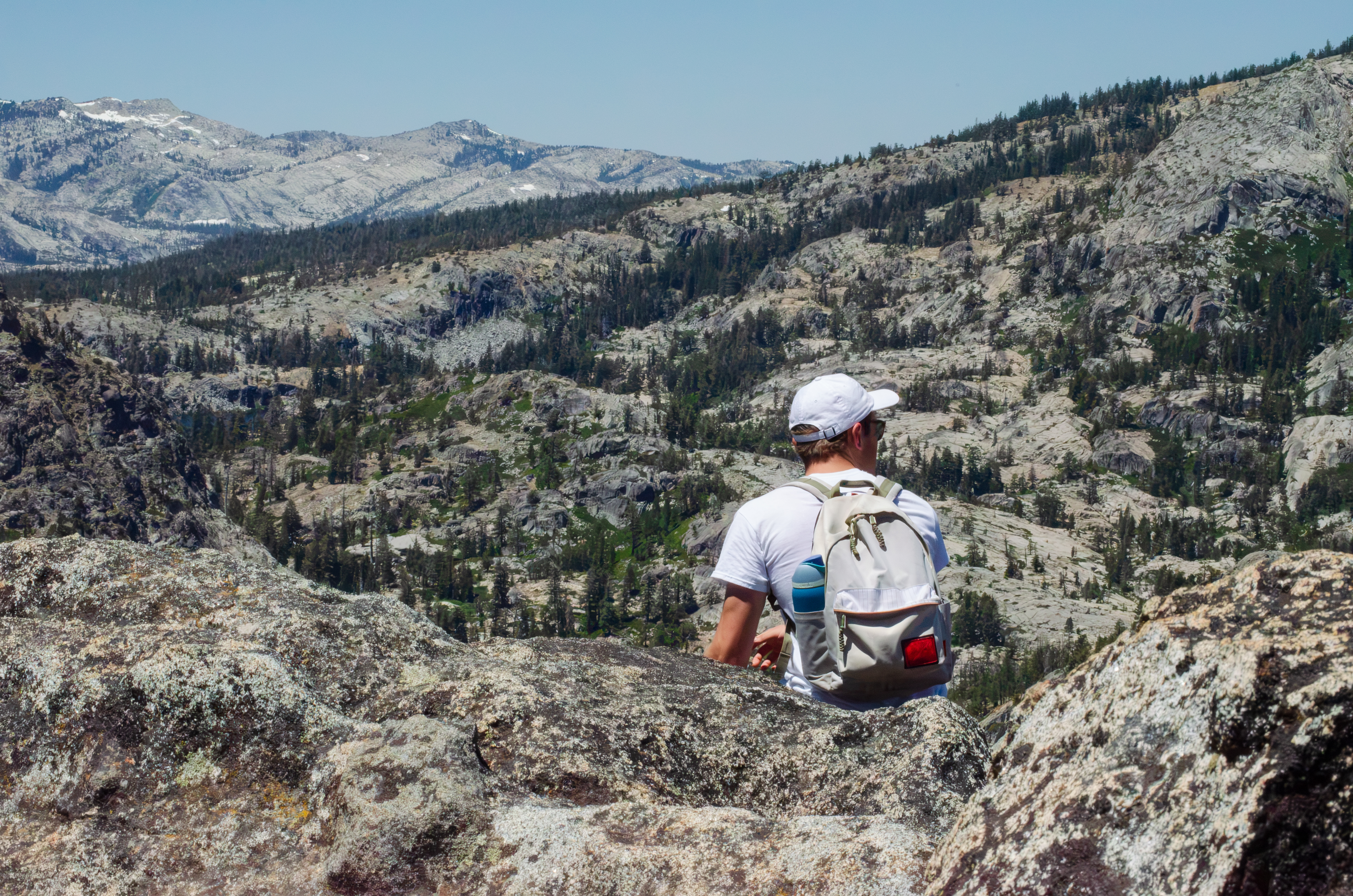 Seb looking out over a granite mountain overlook.